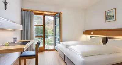 Ein Bett oder Betten in einem Zimmer der Unterkunft Hotel & Bildungshaus St. Jodern
