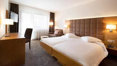 Ein Bett oder Betten in einem Zimmer der Unterkunft Hotel Olympic - Montana Center
