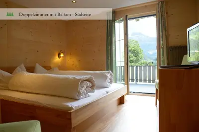Ein Bett oder Betten in einem Zimmer der Unterkunft Hotel Waldrand