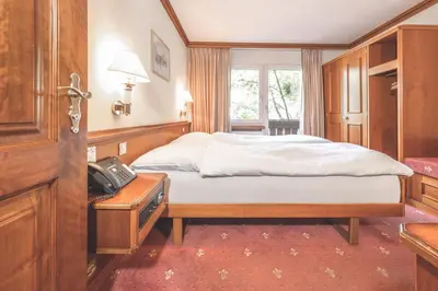 Ein Bett oder Betten in einem Zimmer der Unterkunft Antares Hotel