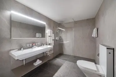 Ein Badezimmer in der Unterkunft Hotel Grindelwalderhof
