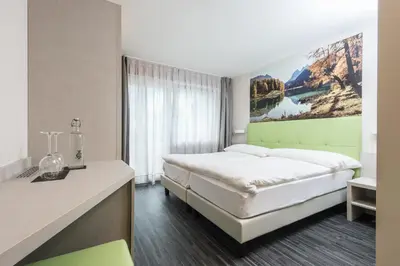 Ein Bett oder Betten in einem Zimmer der Unterkunft Adhhoc Hotel