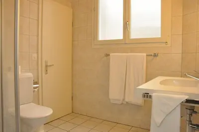 Ein Badezimmer in der Unterkunft Sonnegg Hotel