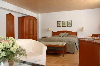 Ein Bett oder Betten in einem Zimmer der Unterkunft Belle Epoque Hotel Victoria & Apartments