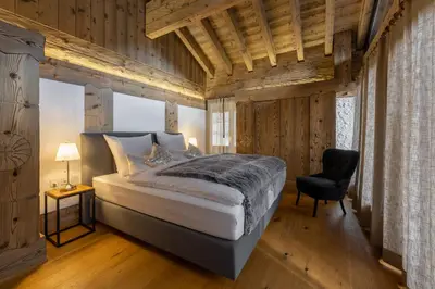 Ein Bett oder Betten in einem Zimmer der Unterkunft Villa Alpenhof