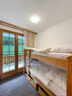 Ein Bett oder Betten in einem Zimmer der Unterkunft Les Mayens de l'Ours - At the foot of Piste de l'Ours' slope!
