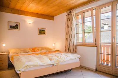 Ein Bett oder Betten in einem Zimmer der Unterkunft Apartment Strassscheuer 3.5 - GriwaRent AG