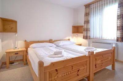 Ein Bett oder Betten in einem Zimmer der Unterkunft Apartment Grindelwaldgletscher - GRIWA RENT AG