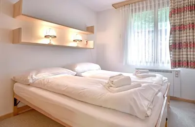 Ein Bett oder Betten in einem Zimmer der Unterkunft Apartment Grindelwaldgletscher - GRIWA RENT AG