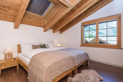 Ein Bett oder Betten in einem Zimmer der Unterkunft Chalet Monte Cristo