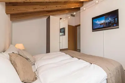 Ein Bett oder Betten in einem Zimmer der Unterkunft Chalet Monte Cristo