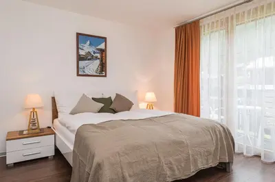 Ein Bett oder Betten in einem Zimmer der Unterkunft Chalet Monte Cristo