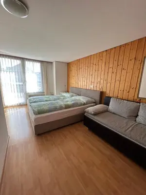 Ein Bett oder Betten in einem Zimmer der Unterkunft Post Hardermannli