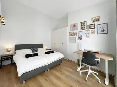 Ein Bett oder Betten in einem Zimmer der Unterkunft Plein Coeur de la Vieille Ville de Sion