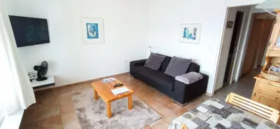 Ein Sitzbereich in der Unterkunft Appartement à Crans-Montana - avec magnifique vue sur la vallée