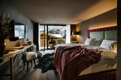 Ein Bett oder Betten in einem Zimmer der Unterkunft Bergwelt Grindelwald - Alpine Design Resort