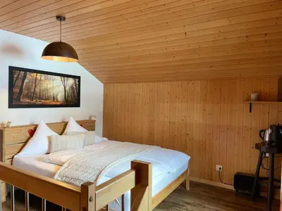 Ein Bett oder Betten in einem Zimmer der Unterkunft Hotel Jägerstübli Grindelwald