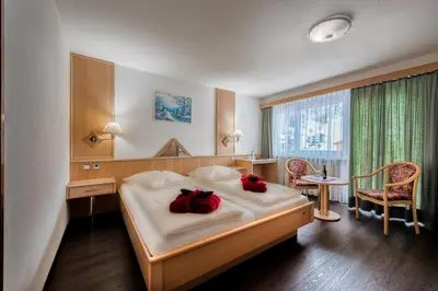 Ein Bett oder Betten in einem Zimmer der Unterkunft Wellness- und Schneesporthotel Christiania