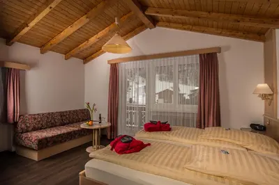 Ein Bett oder Betten in einem Zimmer der Unterkunft Wellness- und Schneesporthotel Christiania