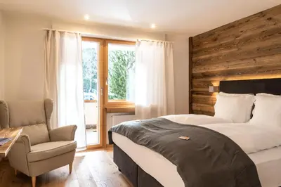 Ein Bett oder Betten in einem Zimmer der Unterkunft Typically Swiss Hotel Ermitage