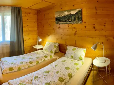Ein Bett oder Betten in einem Zimmer der Unterkunft Apartment Chalet Jungtalblick Eggeri by Interhome