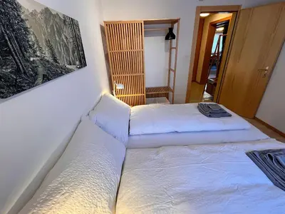 Ein Bett oder Betten in einem Zimmer der Unterkunft Apartment Chalet Jungtalblick Drieri by Interhome