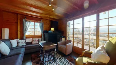 Ein Sitzbereich in der Unterkunft Apartment at the bottom of the slopes in Crans-Montana, cosy atmosphere