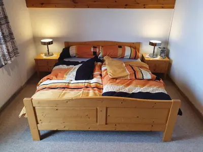 Ein Bett oder Betten in einem Zimmer der Unterkunft Chalet Alba A