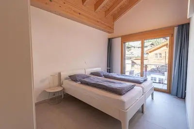 Ein Bett oder Betten in einem Zimmer der Unterkunft Luxury Penthouse Sonnenhof