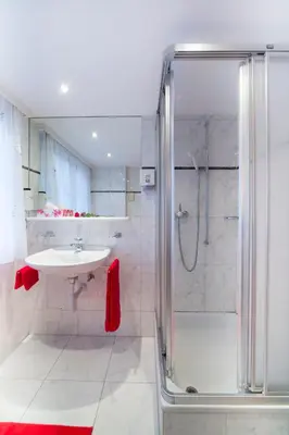 Ein Badezimmer in der Unterkunft Hotel Olympia