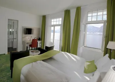 Ein Bett oder Betten in einem Zimmer der Unterkunft Hotel Restaurant Bellevue au Lac