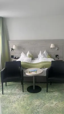 Ein Bett oder Betten in einem Zimmer der Unterkunft Hotel Restaurant Bellevue au Lac