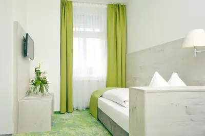 Ein Bett oder Betten in einem Zimmer der Unterkunft Hotel Restaurant Bellevue au Lac