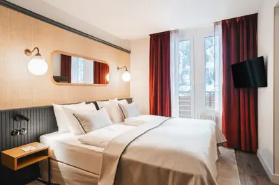 Ein Bett oder Betten in einem Zimmer der Unterkunft Braunbär Hotel & Spa