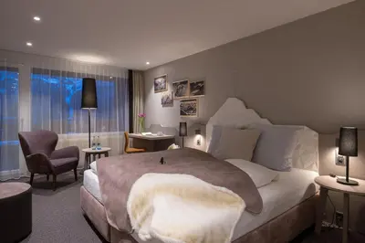 Ein Bett oder Betten in einem Zimmer der Unterkunft Sunstar Hotel & SPA Grindelwald