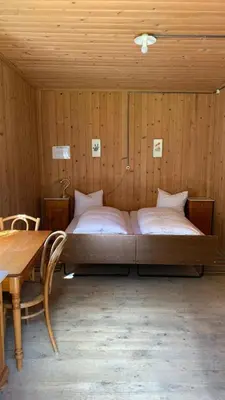 Ein Bett oder Betten in einem Zimmer der Unterkunft Berghaus Iffigenalp