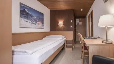 Ein Bett oder Betten in einem Zimmer der Unterkunft Hotel Rössli