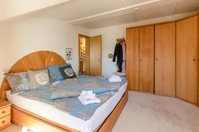 Ein Bett oder Betten in einem Zimmer der Unterkunft Chalet Aargovia