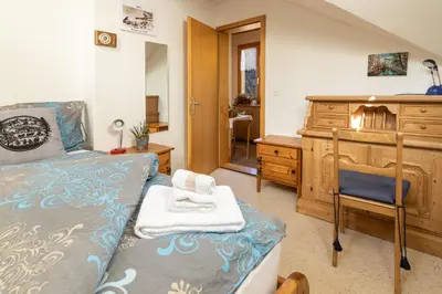 Ein Bett oder Betten in einem Zimmer der Unterkunft Chalet Aargovia