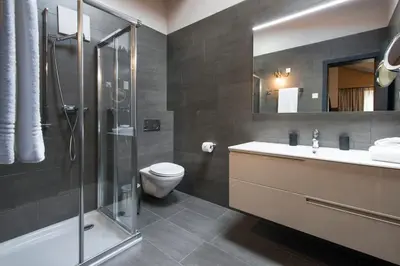 Ein Badezimmer in der Unterkunft Modernes Apartment, beim Bahnhof by ZermattStays