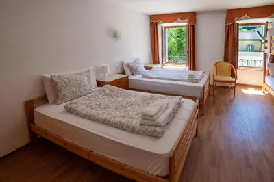 Ein Bett oder Betten in einem Zimmer der Unterkunft Hotel Des Alpes - Restaurant & Pizzeria