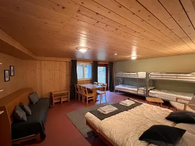 Ein Bett oder Betten in einem Zimmer der Unterkunft Family & Mountain Lodge C'est la Vie