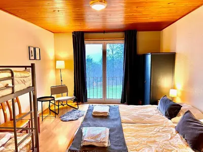 Ein Bett oder Betten in einem Zimmer der Unterkunft Family & Mountain Lodge C'est la Vie