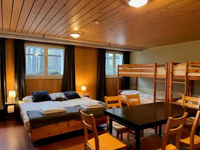 Ein Bett oder Betten in einem Zimmer der Unterkunft Family & Mountain Lodge C'est la Vie