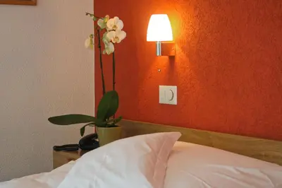 Ein Bett oder Betten in einem Zimmer der Unterkunft Hotel Berghof Amaranth