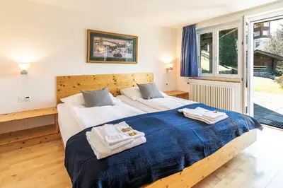 Ein Bett oder Betten in einem Zimmer der Unterkunft Chalet Steingärtli 1