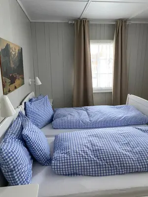 Ein Bett oder Betten in einem Zimmer der Unterkunft Familienferien im Chalet Bärgli Kandersteg
