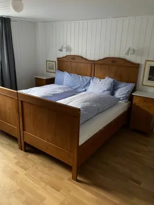 Ein Bett oder Betten in einem Zimmer der Unterkunft Familienferien im Chalet Bärgli Kandersteg