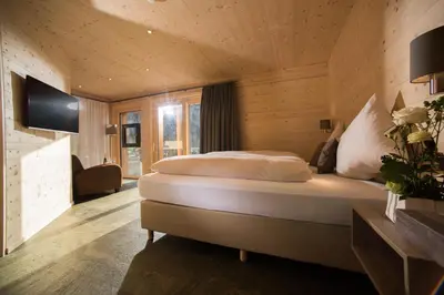 Ein Bett oder Betten in einem Zimmer der Unterkunft Hotel Silberhorn