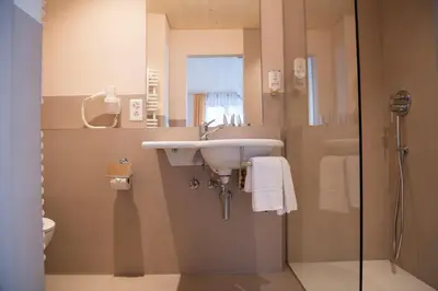 Ein Badezimmer in der Unterkunft Hotel Silberhorn